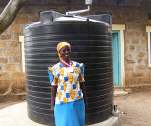 woman in front of water tank